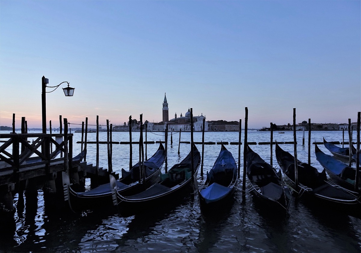 Gondolas moored at dawn with San Giorgio Maggiore behind